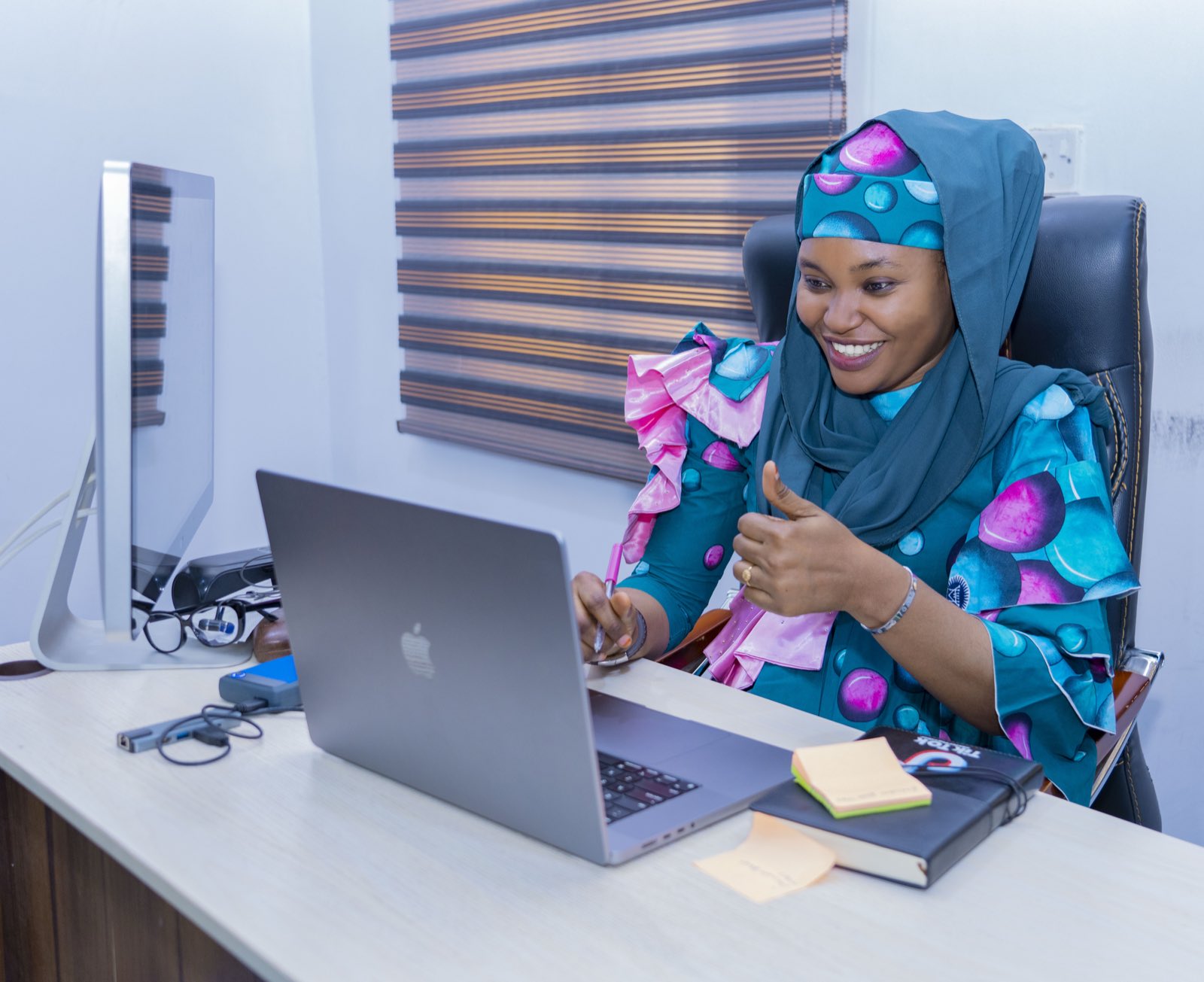 A tutor working with a learner during a Hausa lesson